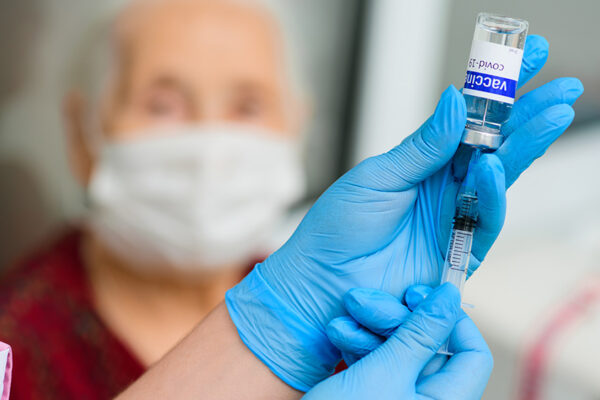 Close-Up-Vial-Syringe-Vaccine-Patient