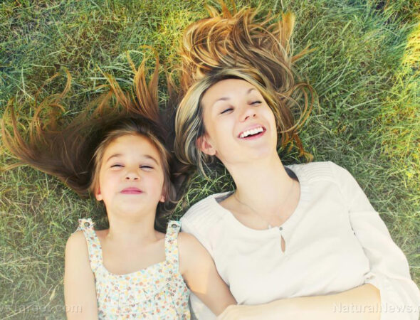 Happy-Little-Girl-Her-Mother-Having-Fun-Grass-Sun