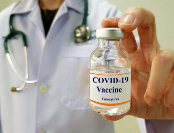 Infectious doctor show COVID 19 vaccine for prevention,immunization and treatment for new corona virus infection(COVID-19,novel coronavirus disease 2019 or nCoV 2019 from Wuhan). Medical technology.