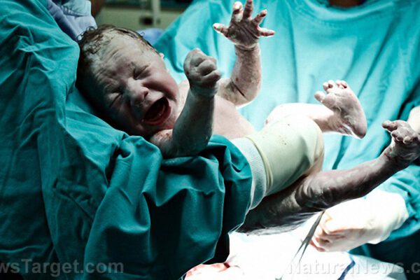 Doctor-Holding-New-Born