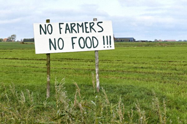 Sign in agricultural field with text No Farmers No Food