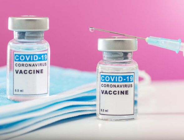 Vaccination concept. Close-up medical syringe with a vaccine.