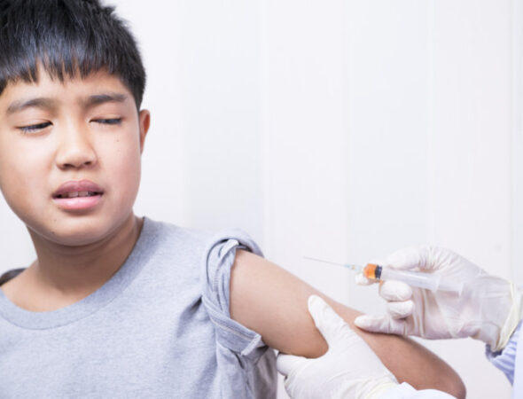 Doctor's,Hand,Injecting,For,Vaccination,In,The,Shoulder,Kid,Patient.vaccine