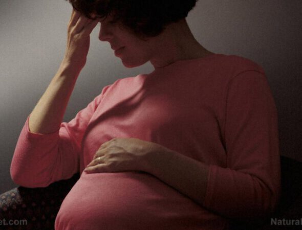 Woman-Stress-Worry-Pregnant-Stomach-Depressed-590x450